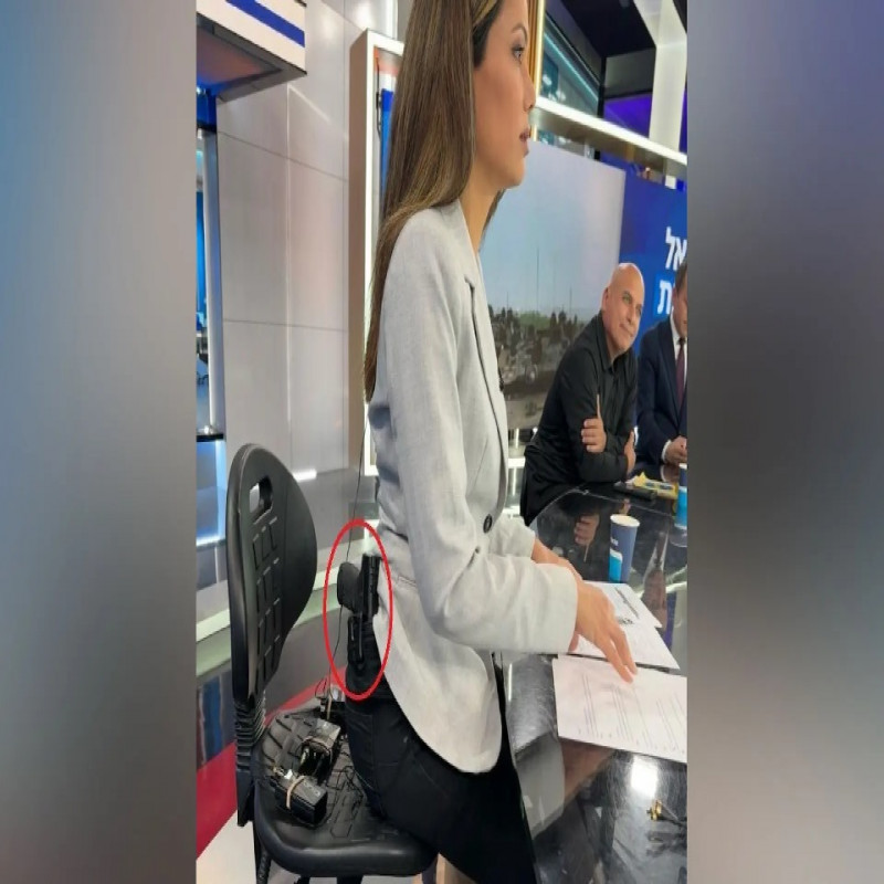 israeli-news-anchor-appears-live-with-gun