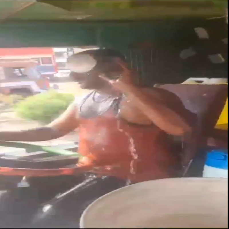 a-person-driving-a-vehicle-while-taking-a-shower..-viral-video